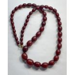 Fine Cherry amber / bakelite necklace good internal streaking largest bead meaures approx. 17mm by 1