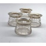 4 Silver and cut glass salt pts each with silver rim Birmingham silver hallmarks