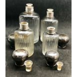 A Fine set of 4 antique french hallmarked silver graduated scent bottles all complete with stoppers