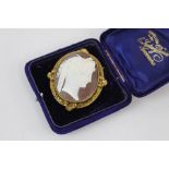 Fine carved cameo brooch measures approx. 6.5cm by 5cm signs of wear & age box is period but not ori