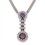 A diamond and gem-set pendant necklace.
