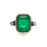 A foil-back emerald and diamond ring.