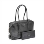 Prada - a black Saffiano leather handbag and purse.