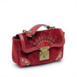 Louis Vuitton - a limited edition monogrammed red velvet and crocodile skin Irvine handbag.