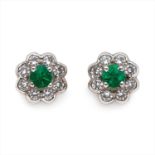 A pair of 18ct gold emerald and diamond stud earrings.