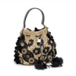 Dolce & Gabbana - a natural woven raffia and snakeskin Claudia bucket bag.