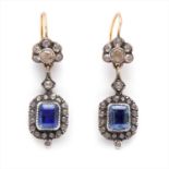 A pair of foil-back sapphire and diamond earrings.