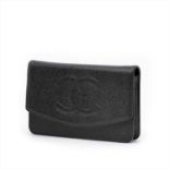 Chanel - a black caviar leather Timeless WOC handbag.