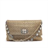 Miu Miu - a gold matelassé crystal leather handbag.