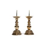 A pair of brass pricket candlesticks, German, mid 17th century