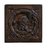 An English carved oak panel depicting a bearded gentleman, dated 1539