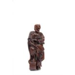 A Flemish walnut figure of St Peter preaching, early 17th century