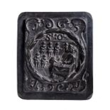 A cast iron plaque or stove plate dated 1571