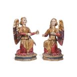Pair of large parcel gilt and polychrome figures of seated angels, South German, early 18th c