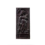 An English carved oak panel of St Andrew, mid 17th century