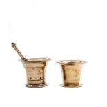 Two brass mortars, one with pestle, English, 18th century
