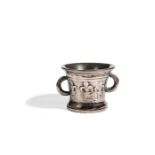 A two-handled bronze mortar with fleur de lys decoration, English, late 17th century