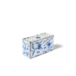 An English Delft blue and white flower brick, 18th century