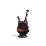 A George III lignum vitae mortar and pestle, circa 1780 and another pestle