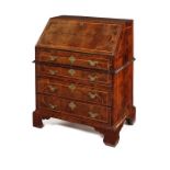 An unusual George I oyster veneered yew wood bureau