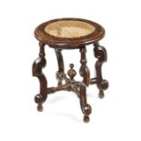 A William and Mary carved beechwood and walnut circular stool