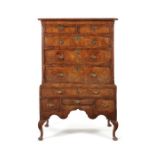 A George I walnut crossbanded and featherbanded chest on stand