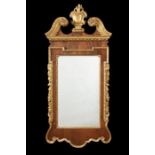 A George II walnut and parcel gilt mirror