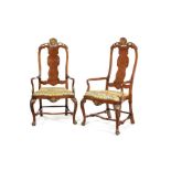 A pair of mid 18th century walnut and parcel gilt open armchairs