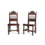 A pair of William and Mary oak hall chairs, late 17th century