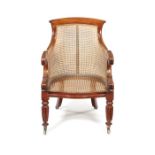 A Regency carved mahogany bergere