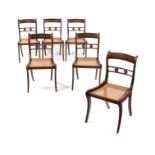 A set of six Regency simulated rosewood and brass inlaid dining chairs