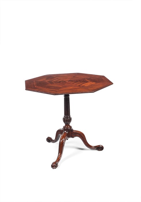 A George III carved mahogany octagonal tripod table attributed to Thomas Chippendale