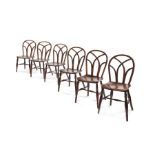 A set of six George IV ash, elm and beech Gothic Windsor chairs