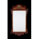 A George II mahogany fret carved mirror