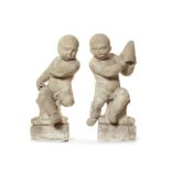 A pair of late 17th/early 18th century carved white marble seated putti