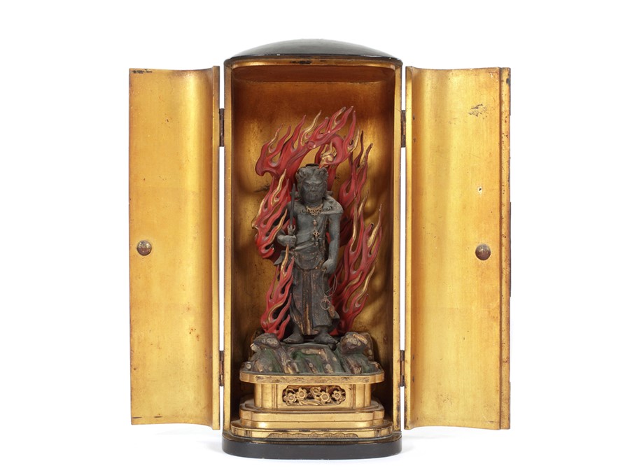 A Meiji period black lacquered portable shrine (zushi)