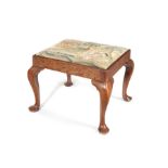 A large George II oak stool