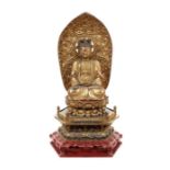 A Taishō period gilt and lacquer seated carved figure of Nyoirin Kannon