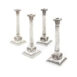 A good set of four Victorian silver plated Corinthian column candlesticks