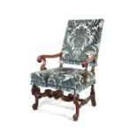 A William and Mary walnut upholstered open armchair