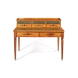 A 19th century French Charles X bird's eye maple and purplewood marquetry writing desk