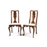 A pair of George I walnut and featherbanded side chairs