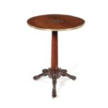 An early 19th century French Charles X rosewood and brass marquetry occasional table