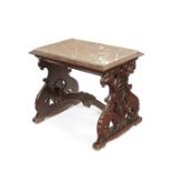 A late 19th century oak carved Renaissance style low table