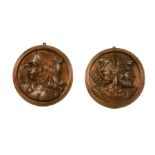 Two pairs of carvings of soldier's heads