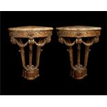 A pair of late 19th century Louis XVI style giltwood carved corner console tables