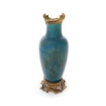 A late 19th century French green glazed vase with gilt bronze mounts