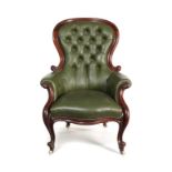 A Victorian carved mahogany gentleman's armchair