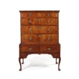 A George I walnut and featherbanded chest on stand