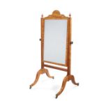 A Regency satinwood cheval mirror attributed to Gillows